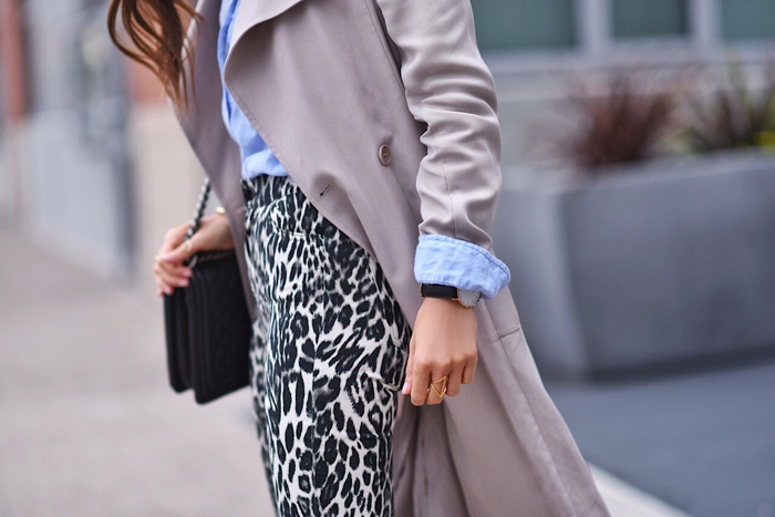 Blank itinerary outfit close up wearing Paola Alberdi wearing 7 for all mankind x Giambattista Valli skinny jeans in leopard with reiss trench coat and forever 21 blue blouse