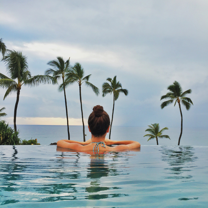 blank itinerary looking out to the horizon in an infinity pool at the four seasons maui resort