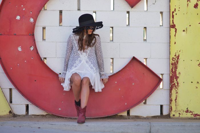 Blank itinerary wearing free people lace dress and red vintage boots