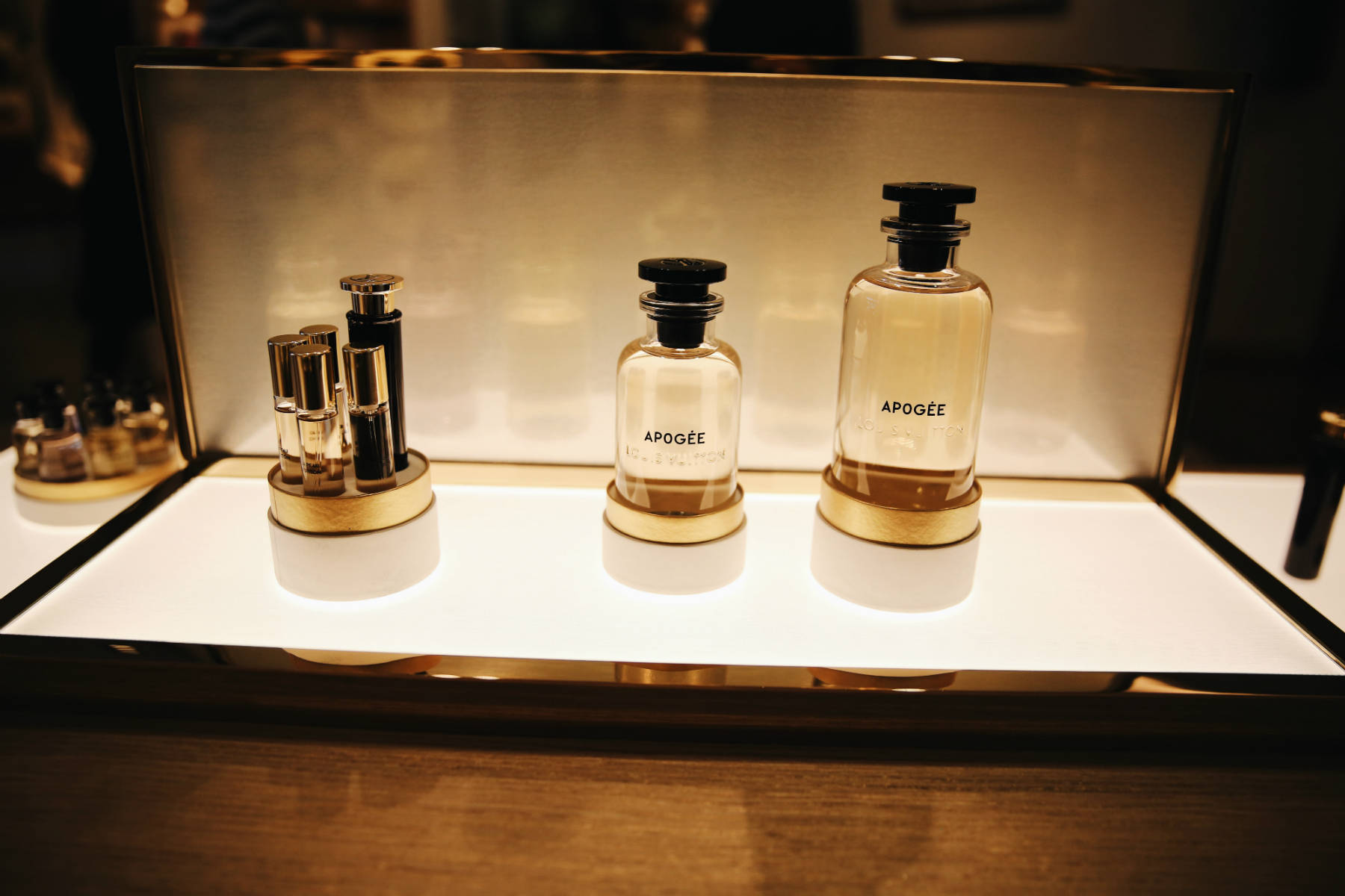 Louis Vuitton Apogee Perfume in a lighted display.