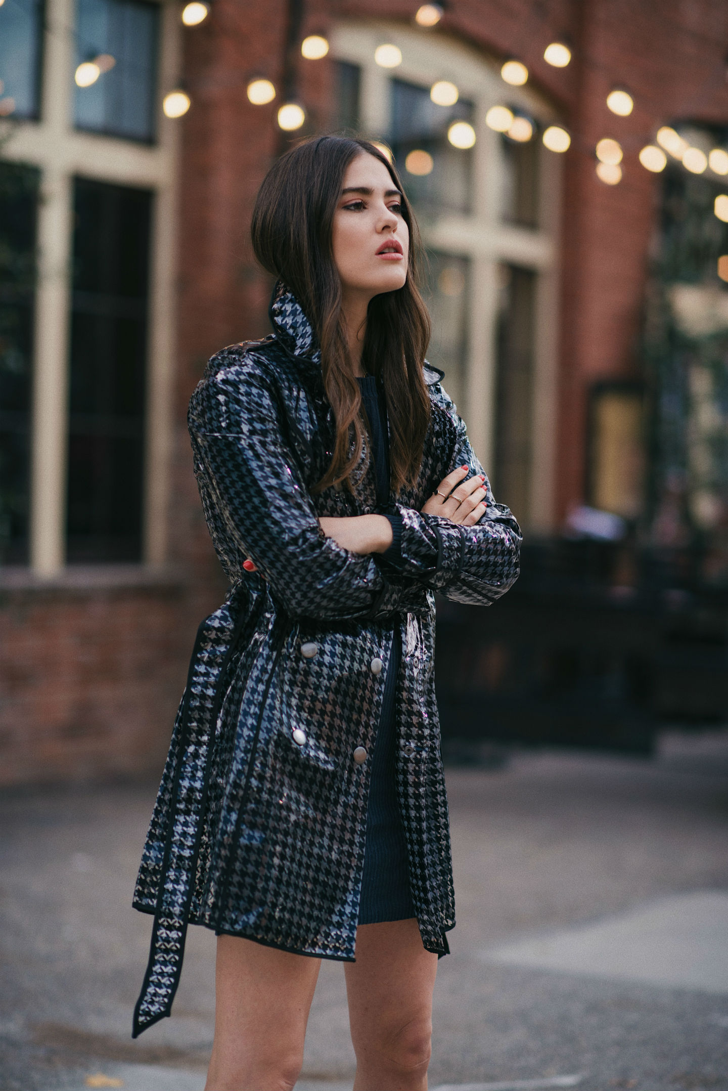 fashion blogger wearing clear raincoat