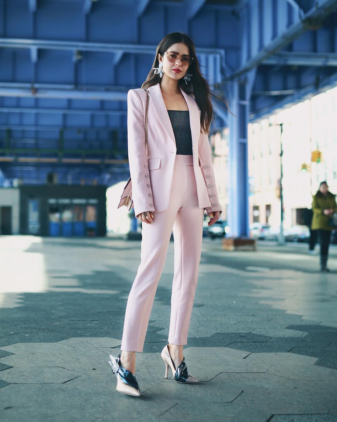 woman in a pink wearing matching pink blazer with trousers